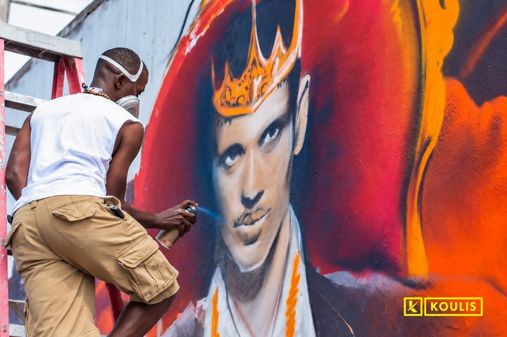 Painting a face: Rayza at work.